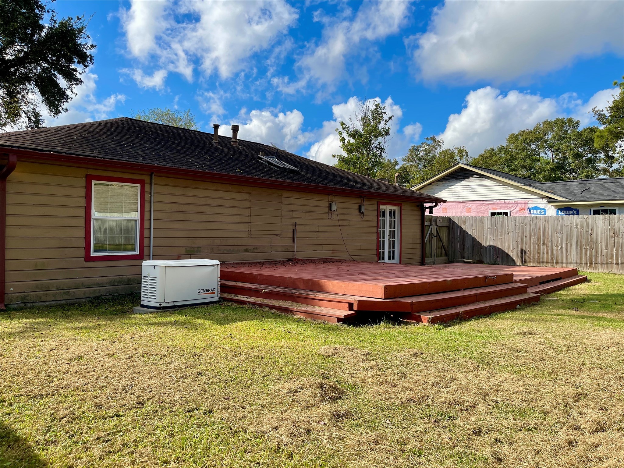 1113 Chevy Chase Drive Angleton, TX 77515 - Photo 28 of 32 a front view of a house with a garden and swimming pool