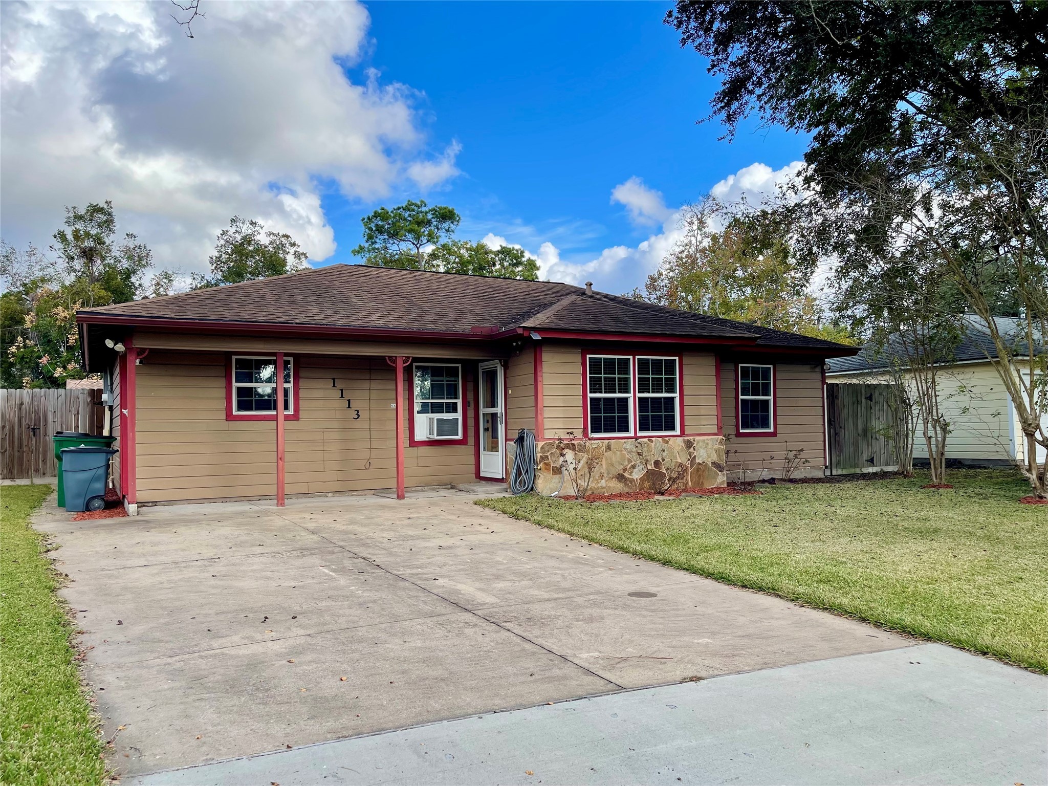 1113 Chevy Chase Drive Angleton, TX 77515 - Photo 4 of 32 front view of a house with a patio