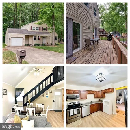 a view of house with deck and outdoor seating