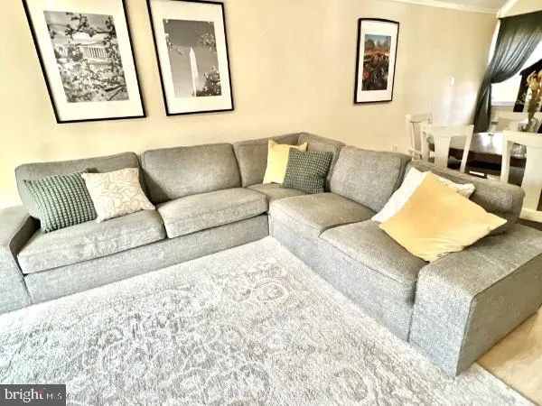a living room with furniture and a couch