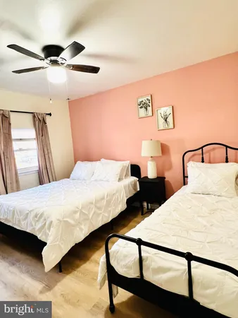 a bedroom with bed and a night stand