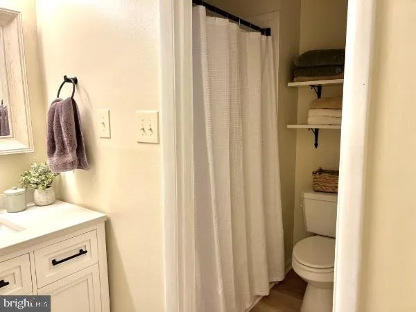 a bathroom with a sink vanity and mirror