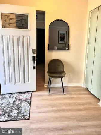a view of a room with wooden floor
