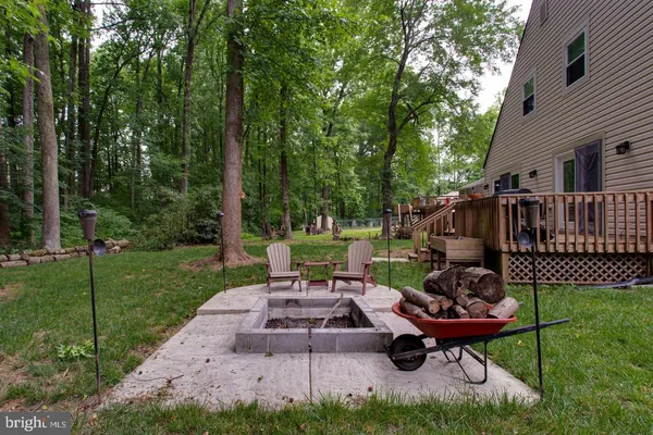 a view of a patio with chairs and a table
