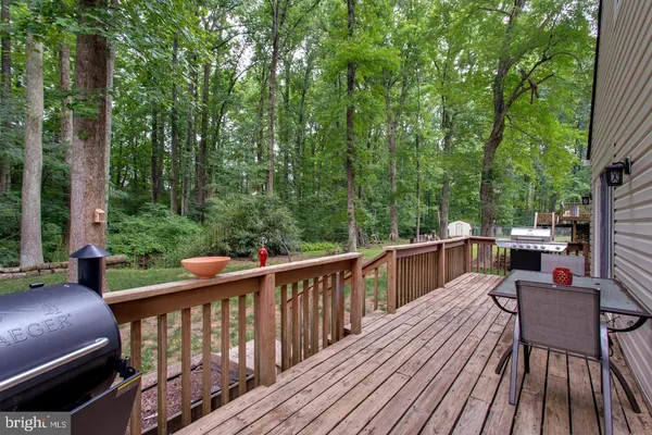 a view of a two chairs on the roof deck