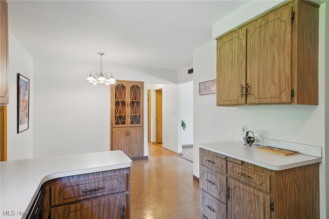 531 Ransome Road Cleveland, OH 44143 - Photo 8 of 27 Kitchen with plenty of cabinets and counterspace, tile backsplash, and all appliances including the newer refrigerator and dishwasher.