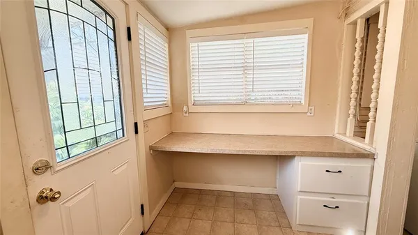 a bathroom with a bathtub and a window