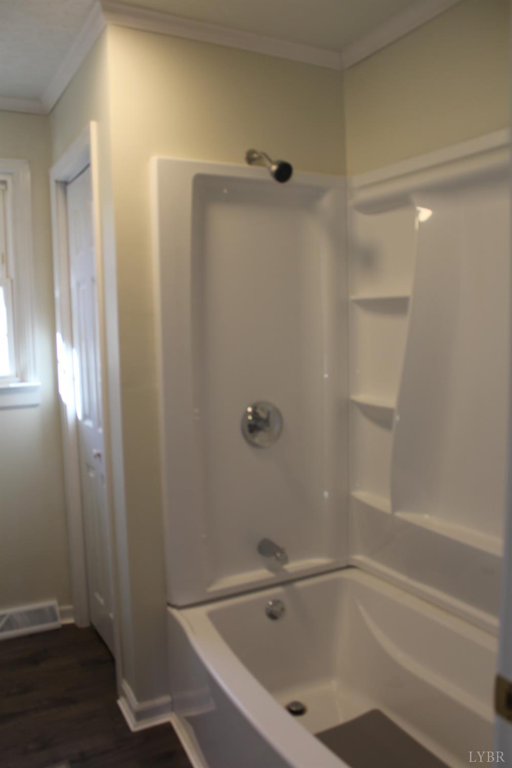 305 Eldon Road Appomattox, VA 24522 - Photo 17 of 24 a bathroom with a bathtub and a shower