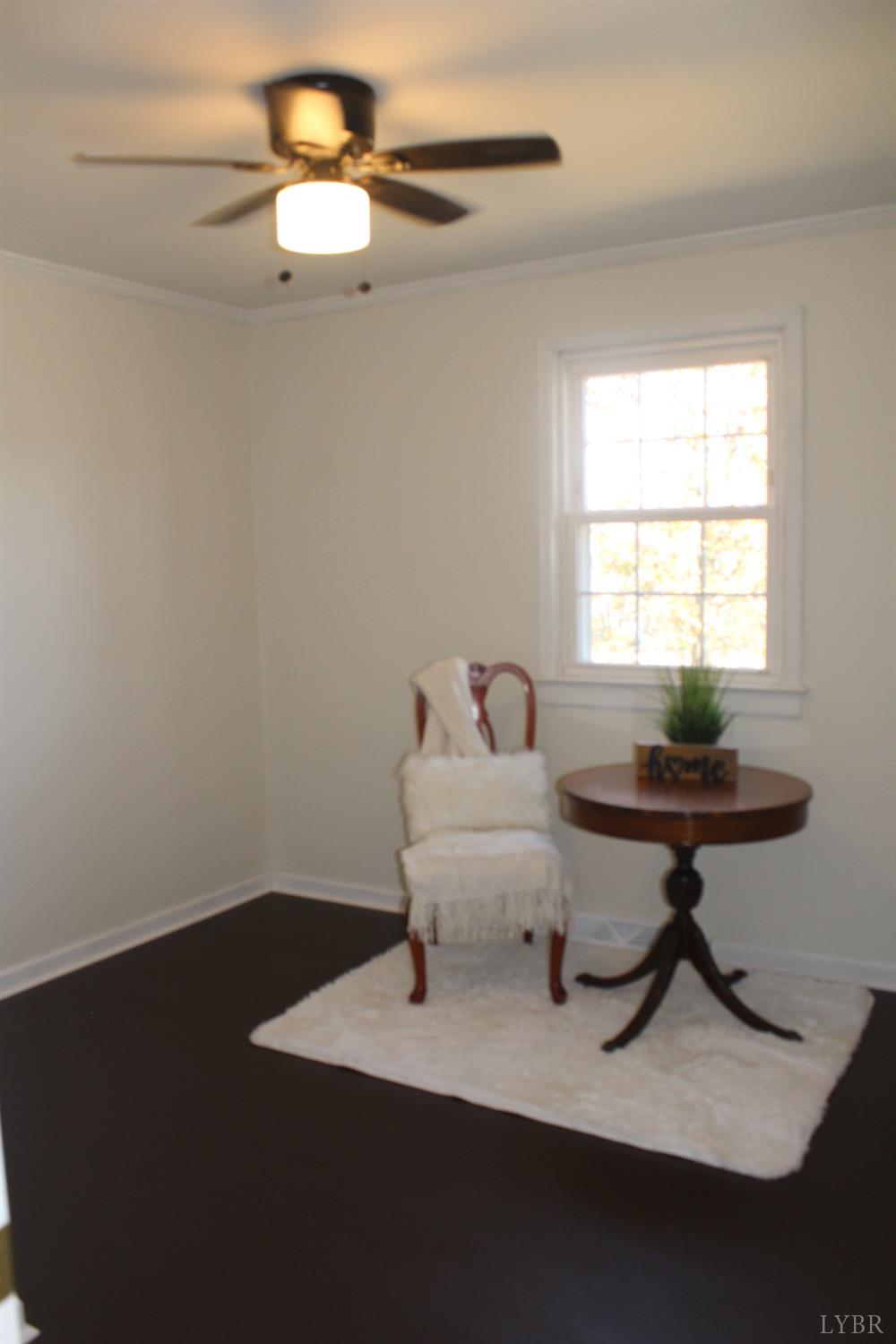 305 Eldon Road Appomattox, VA 24522 - Photo 19 of 24 a living room with furniture a window and a table