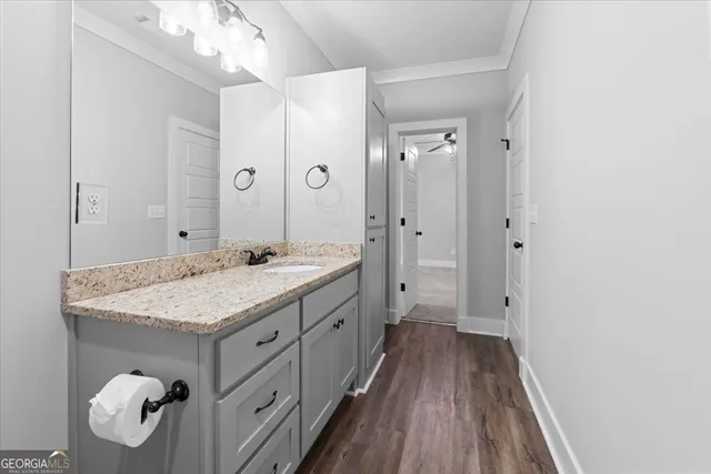 a view of an empty room with a fireplace and a window