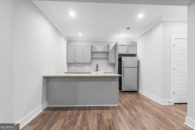 a aerial view of a house with swimming pool garden and patio