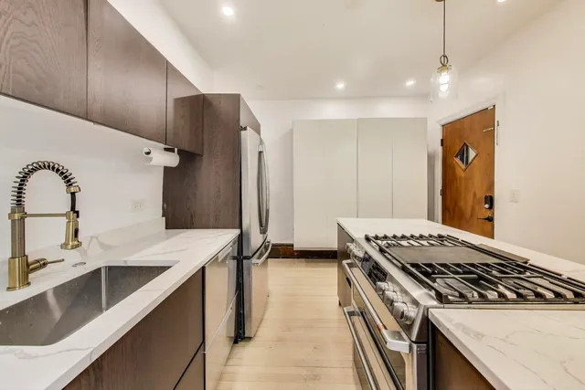 a kitchen with a stove and a sink