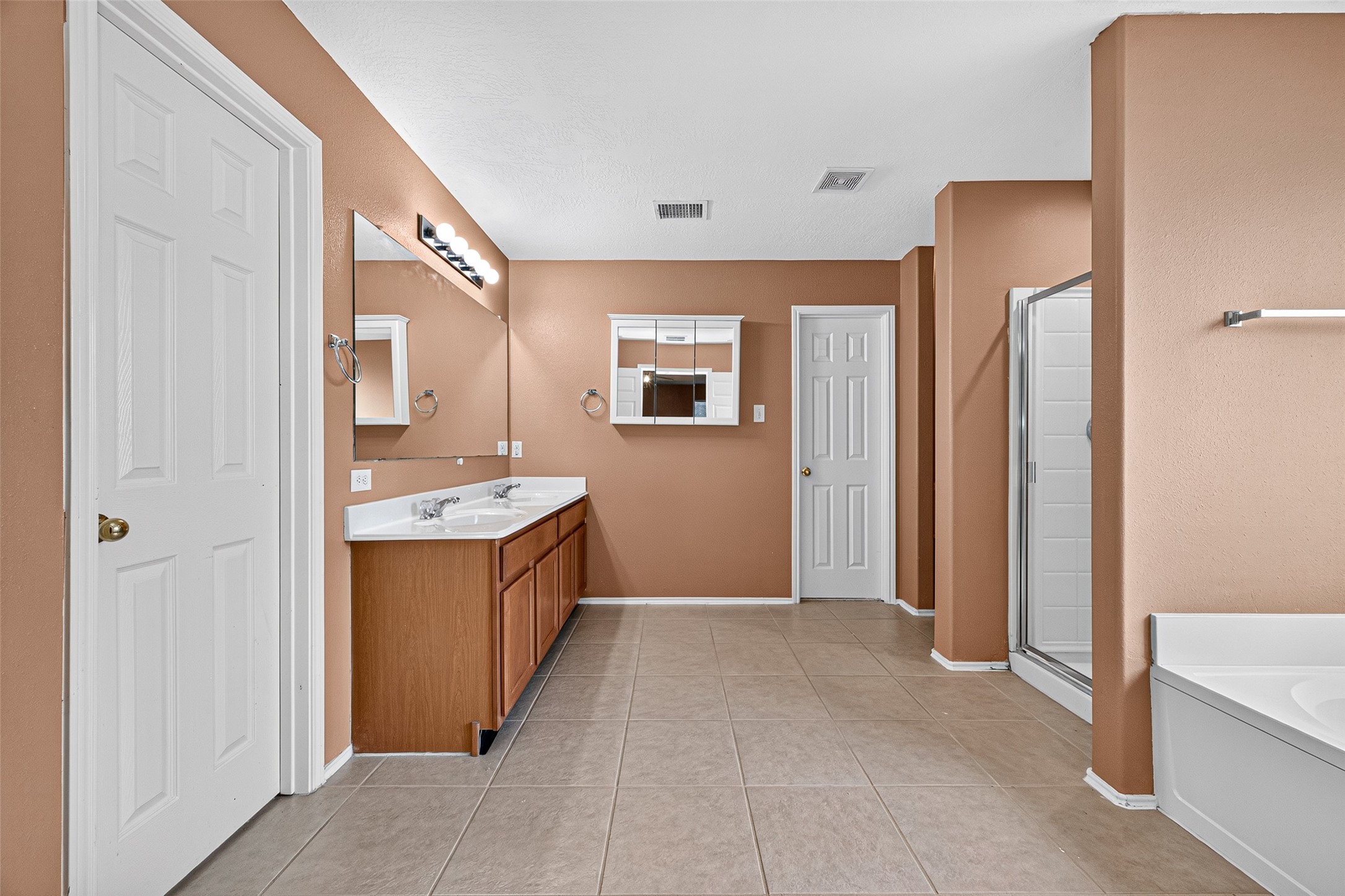 6822 Baron Gate Court Spring, TX 77379 - Photo 38 of 49 Step into the en-suite primary bathroom, designed for ultimate relaxation.
