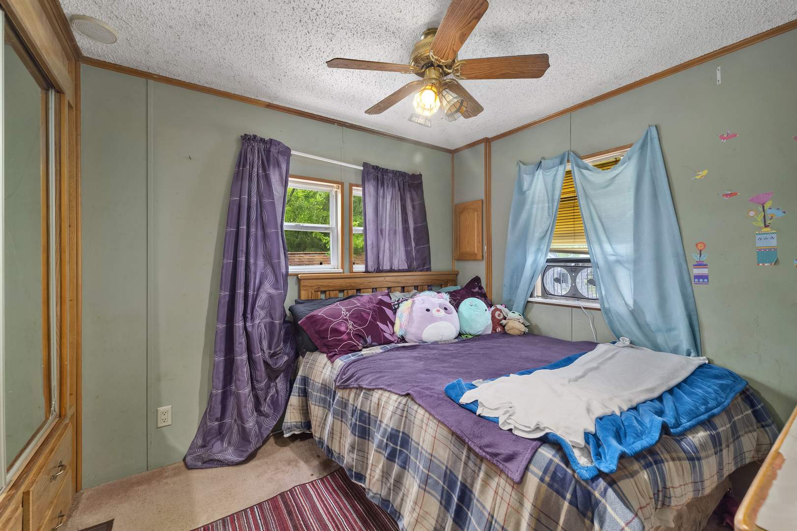 59 Dinosaur Road Wilmington, IL 60481 - Photo 11 of 17 a bedroom with a bed and a chandelier