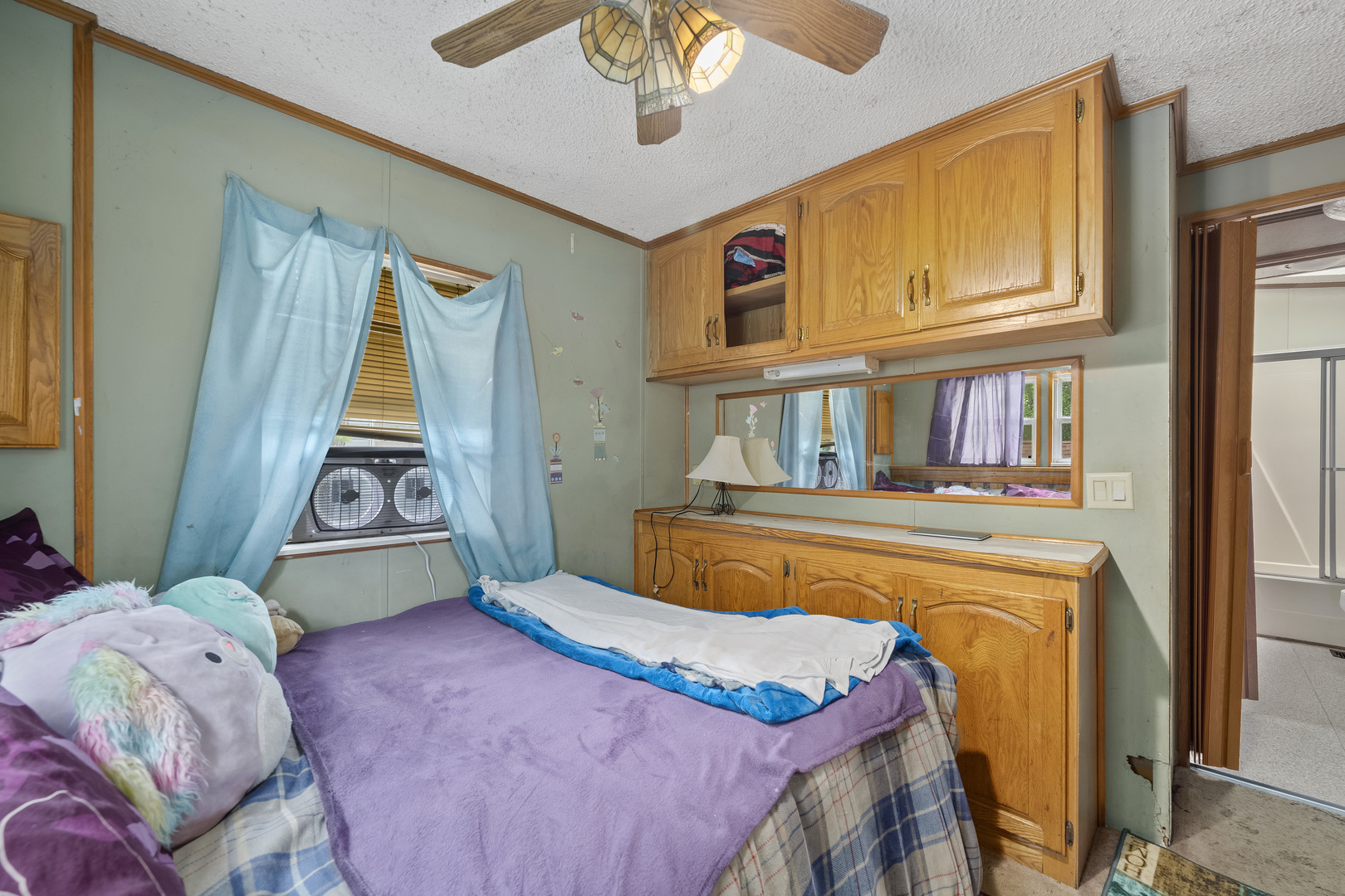 59 Dinosaur Road Wilmington, IL 60481 - Photo 12 of 17 a bedroom with bed and a window