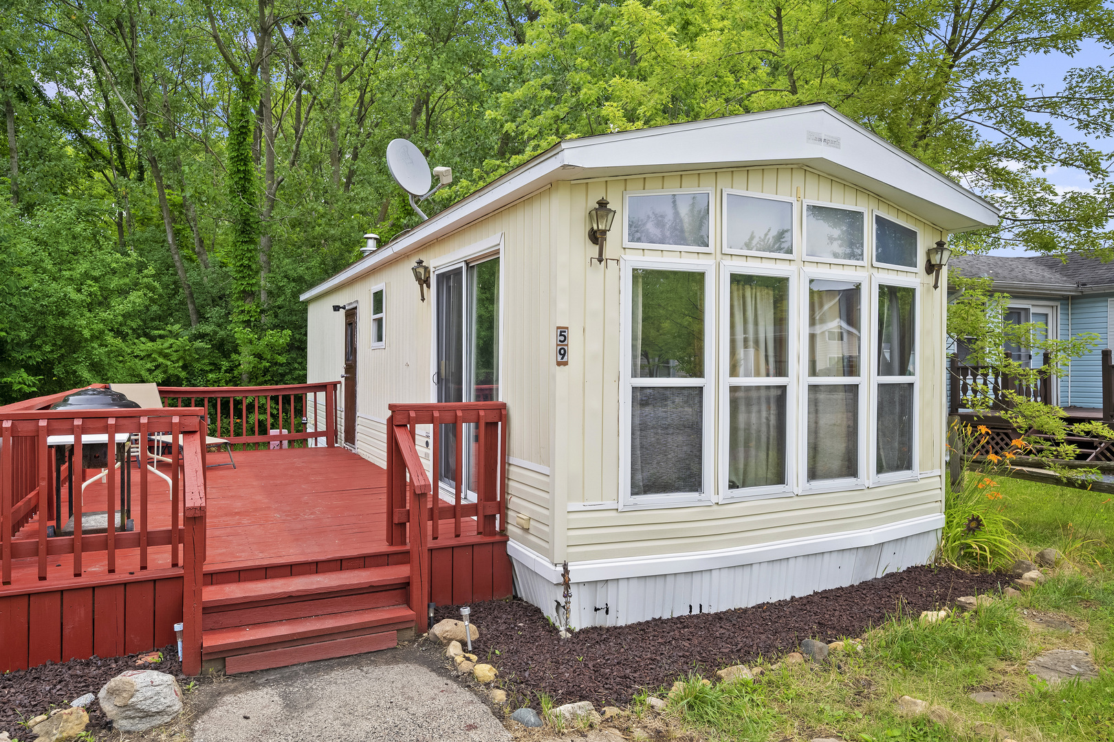 59 Dinosaur Road Wilmington, IL 60481 - Photo 2 of 17 a backyard of a house with wooden floor and fence