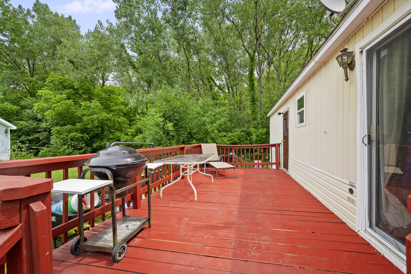 59 Dinosaur Road Wilmington, IL 60481 - Photo 3 of 17 a balcony with wooden floor and outdoor seating