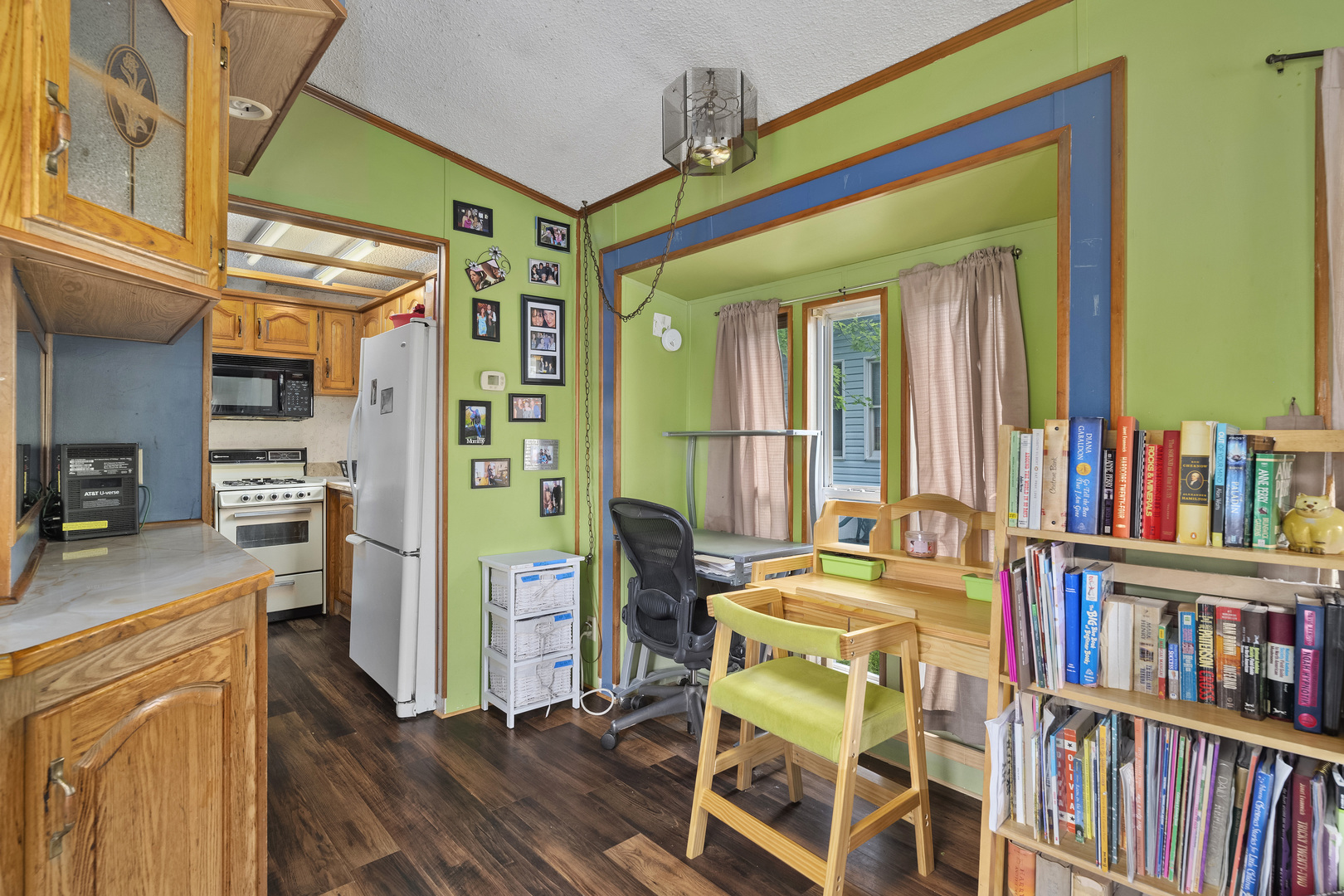 59 Dinosaur Road Wilmington, IL 60481 - Photo 9 of 17 a view of a workspace with furniture and a book shelf
