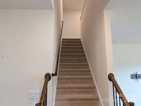 a view of a hallway with stairs