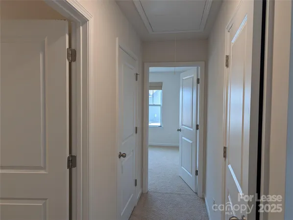 a view of a bathroom from a hallway with toilet