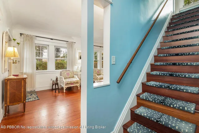 a view of entryway and hall with wooden floor