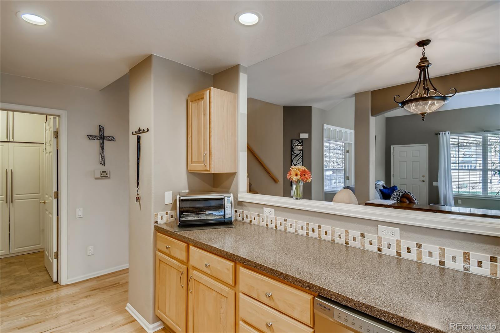 6214 Trailhead Road Highlands Ranch, CO 80130 - Photo 11 of 29 a view of a kitchen from the hallway
