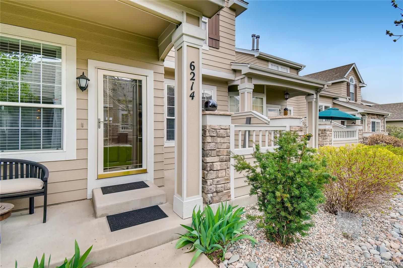 6214 Trailhead Road Highlands Ranch, CO 80130 - Photo 2 of 29 a front view of a house with garden