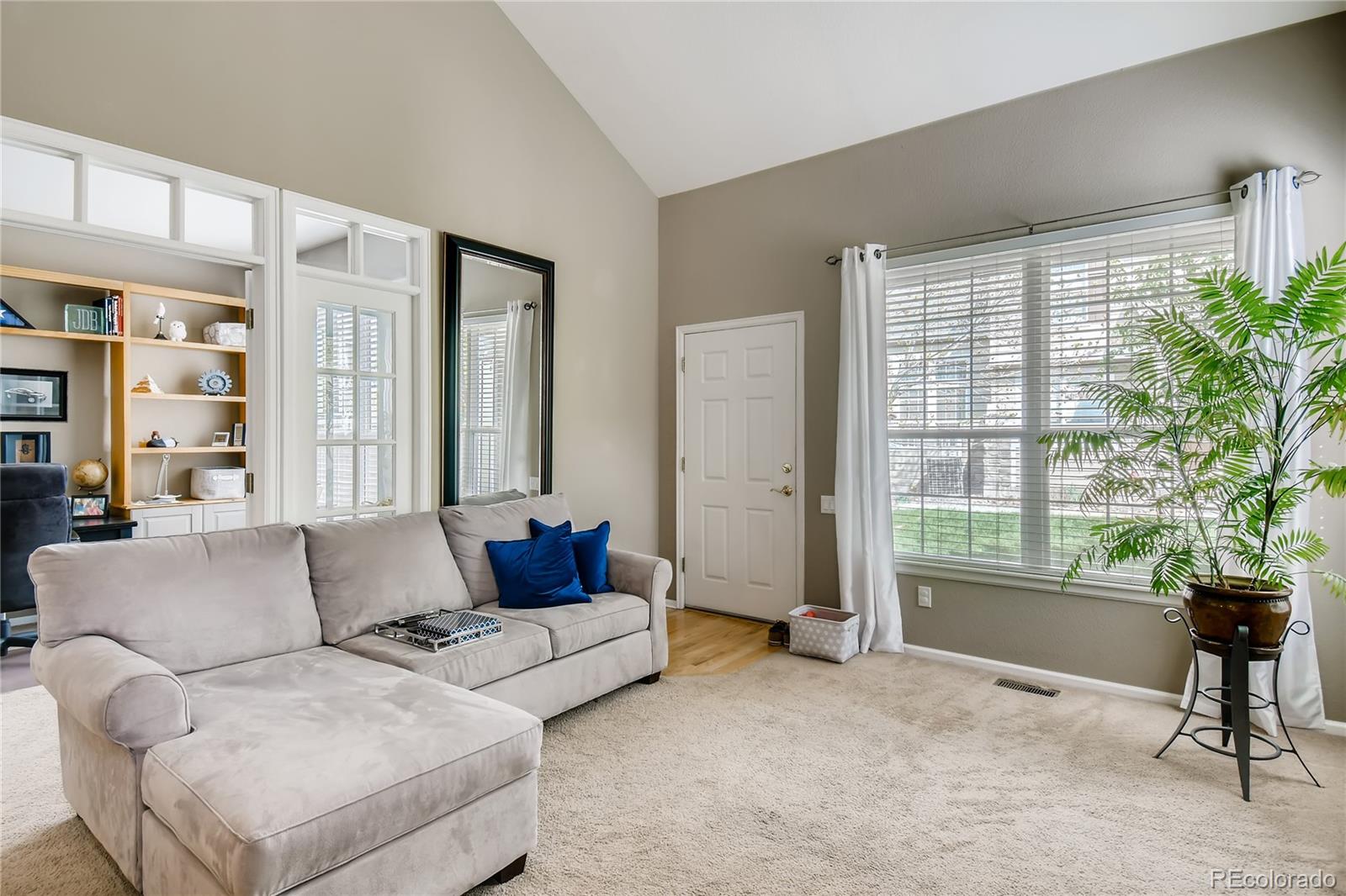 6214 Trailhead Road Highlands Ranch, CO 80130 - Photo 5 of 29 a living room with furniture and a large window