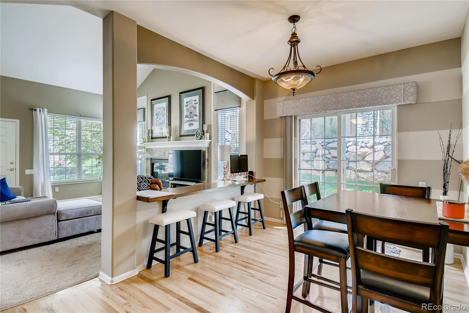 6214 Trailhead Road Highlands Ranch, CO 80130 - Photo 7 of 29 a view of a dining room with furniture window and outside view