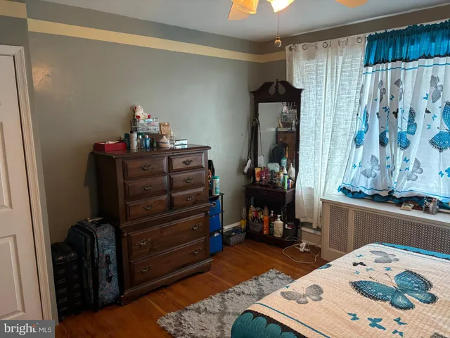 a bed room with a bed and a dresser