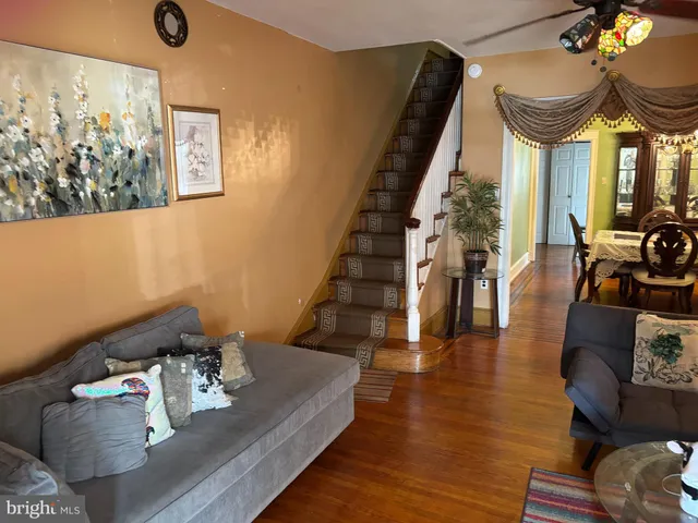 a view of dining room with furniture and wooden floor