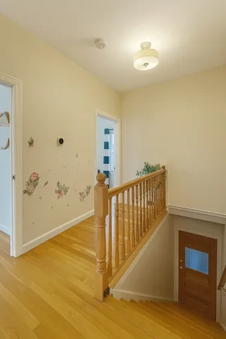 a view of entryway with wooden floor