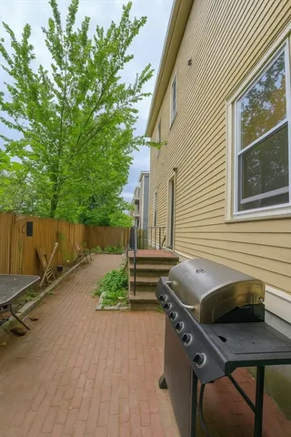 a backyard of a house with outdoor seating