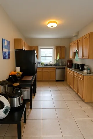a kitchen with stainless steel appliances granite countertop a sink and a stove