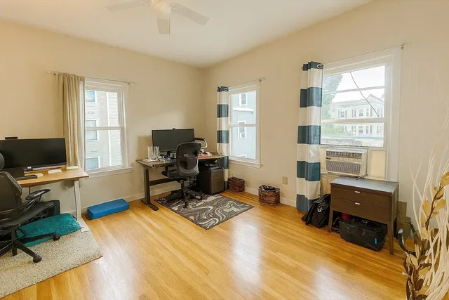 a bedroom with a workspace