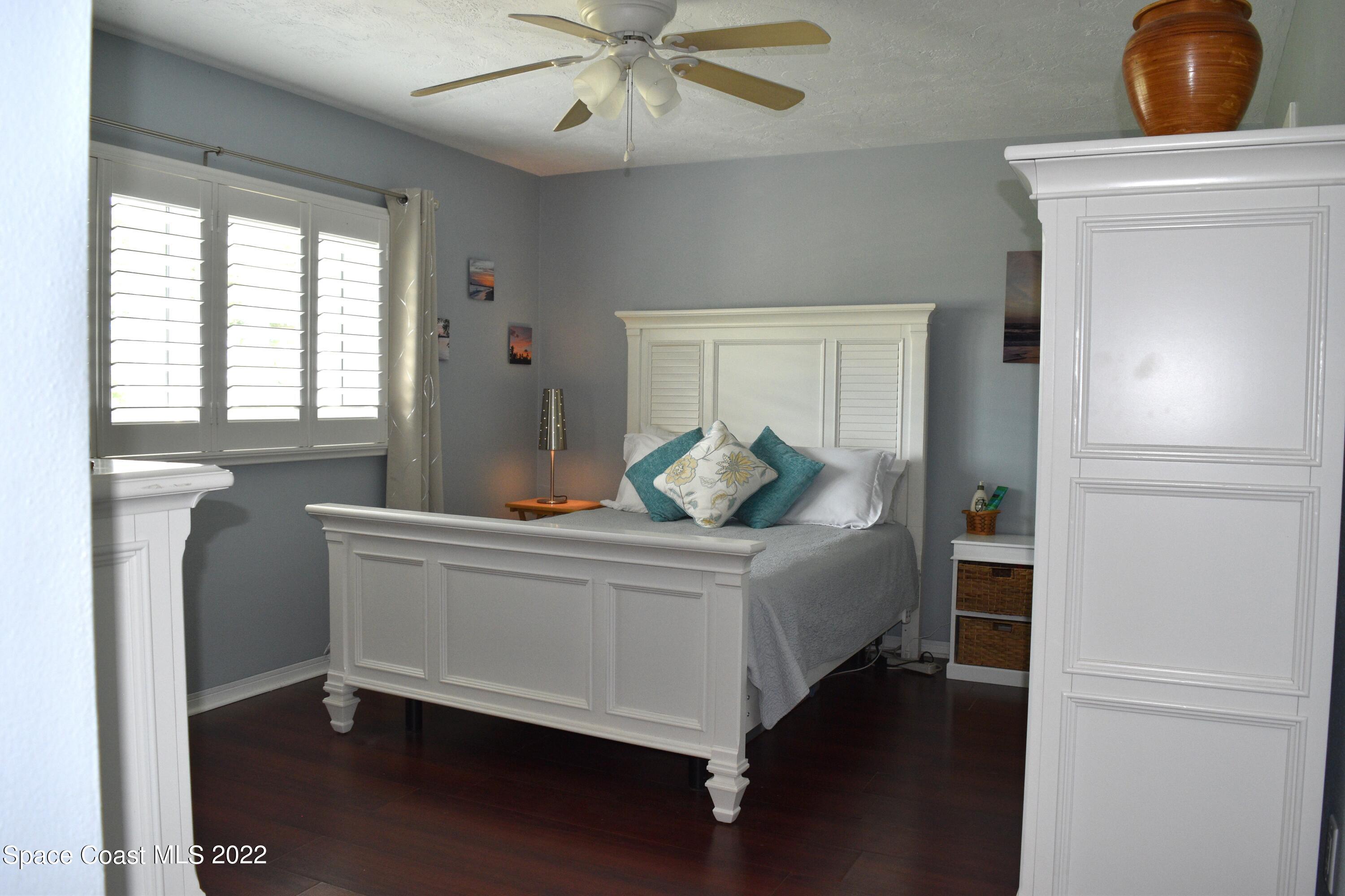 511 South Sonora Circle Indialantic, FL 32903 - Photo 6 of 10 a bedroom with a bed and window