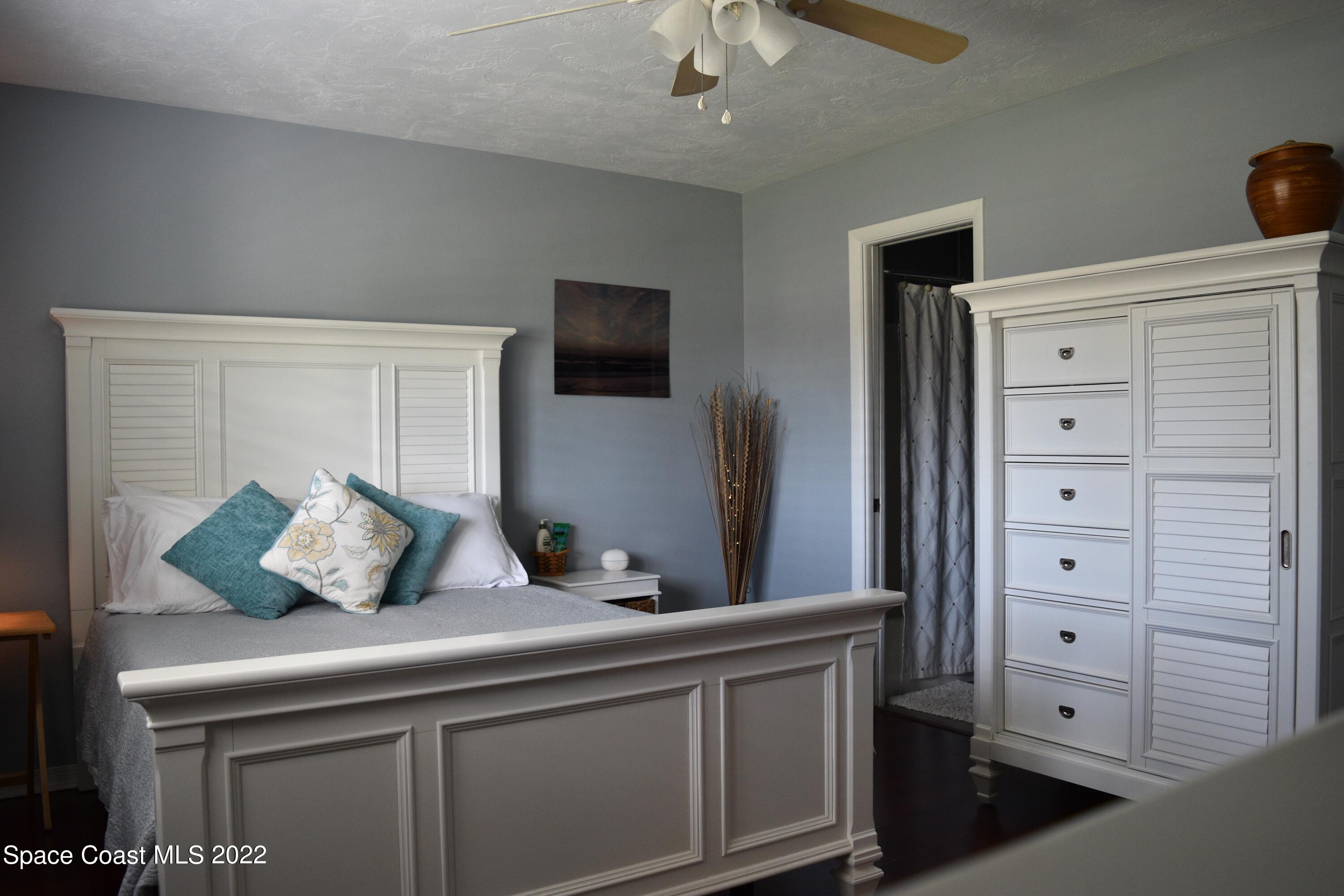 511 South Sonora Circle Indialantic, FL 32903 - Photo 7 of 10 a bedroom with a bed and a television