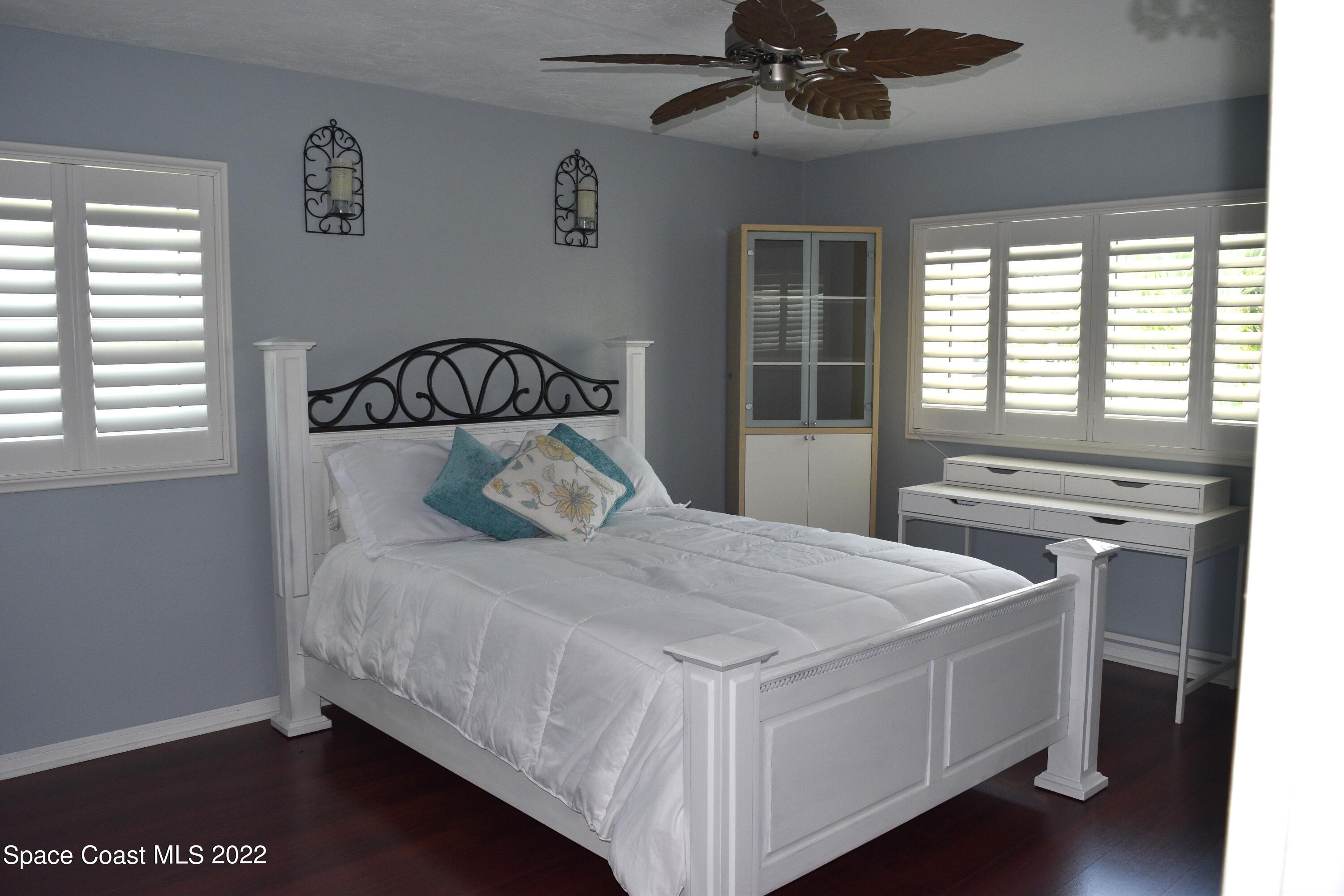 511 South Sonora Circle Indialantic, FL 32903 - Photo 9 of 10 a bedroom with a bed and a window