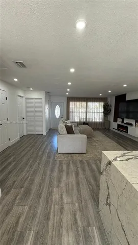 a view of kitchen and a sink with wooden floor