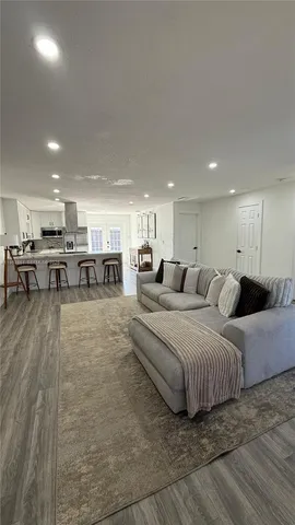 a living room with furniture and a table