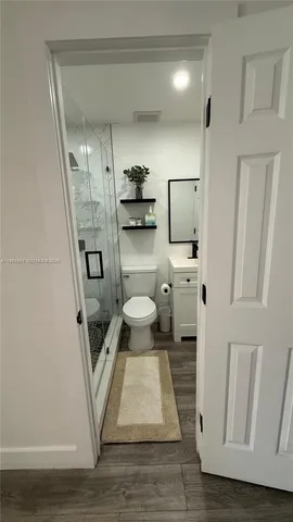 a bathroom with a sink and toilet