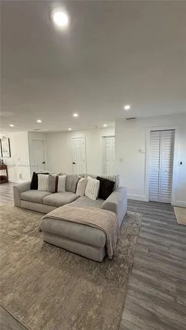 a large bedroom with a bed and a view of bedroom