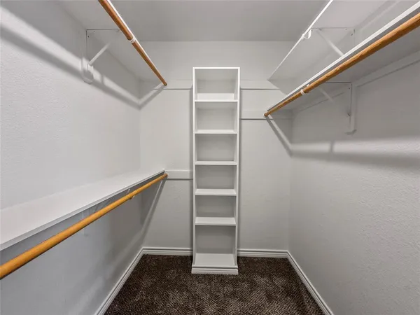 a view of an empty walk in closet