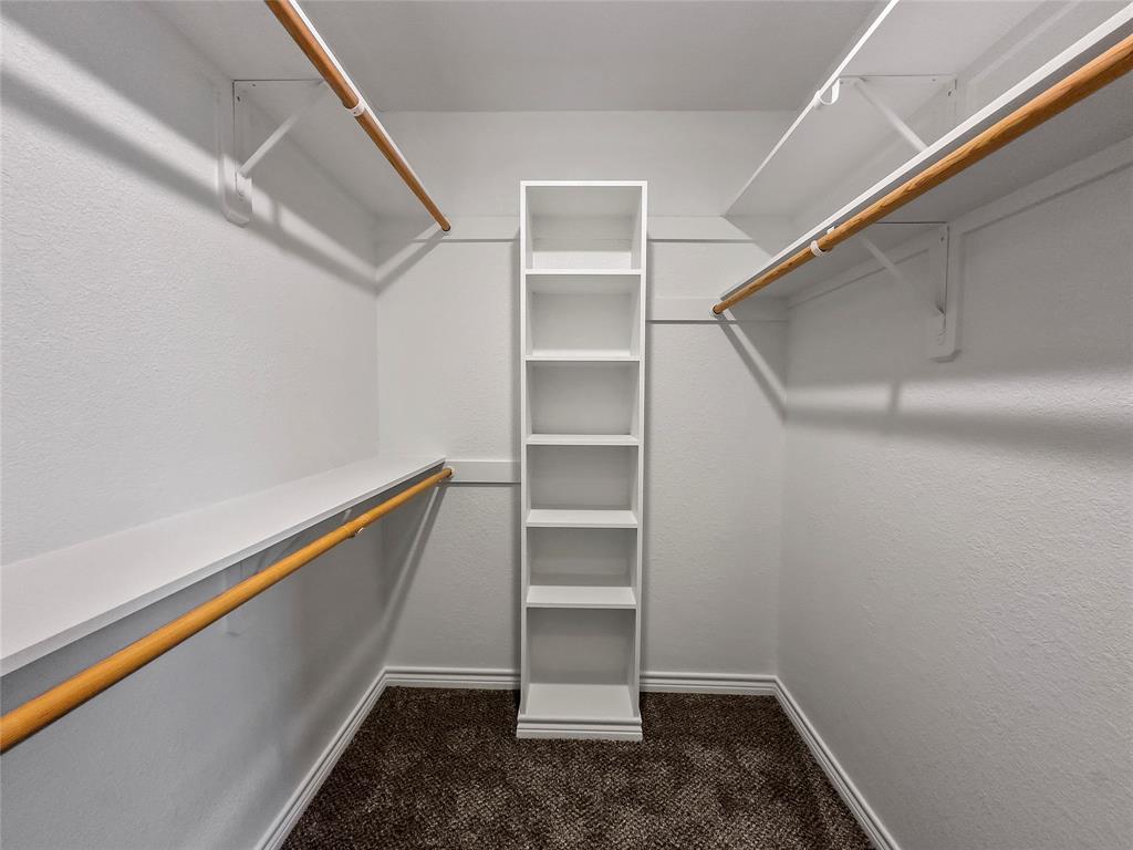 225 Oak Court, Unit 225 Rhome, TX 76078 - Photo 16 of 30 a view of an empty walk in closet