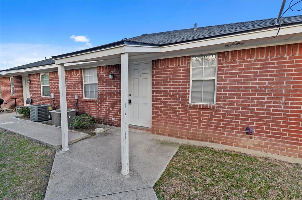 225 Oak Court, Unit 225 Rhome, TX 76078 - Photo 23 of 30 a front view of a house with a garage
