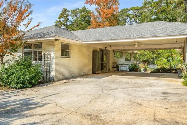 a view of a house with a yard and plants