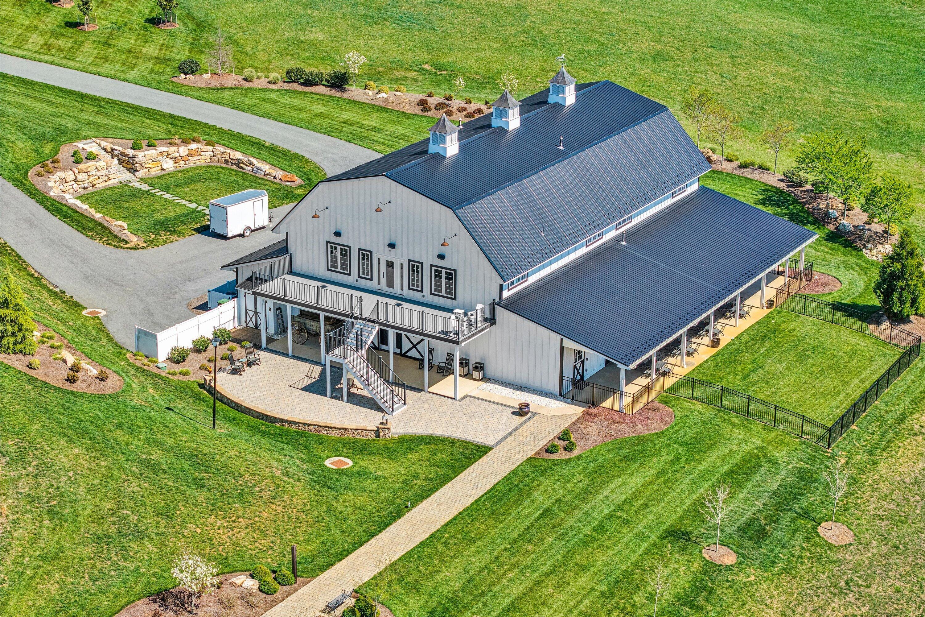 9945 Brooks Mill Road Wirtz, VA 24184 - Photo 1 of 69 an aerial view of a house with swimming pool garden and patio