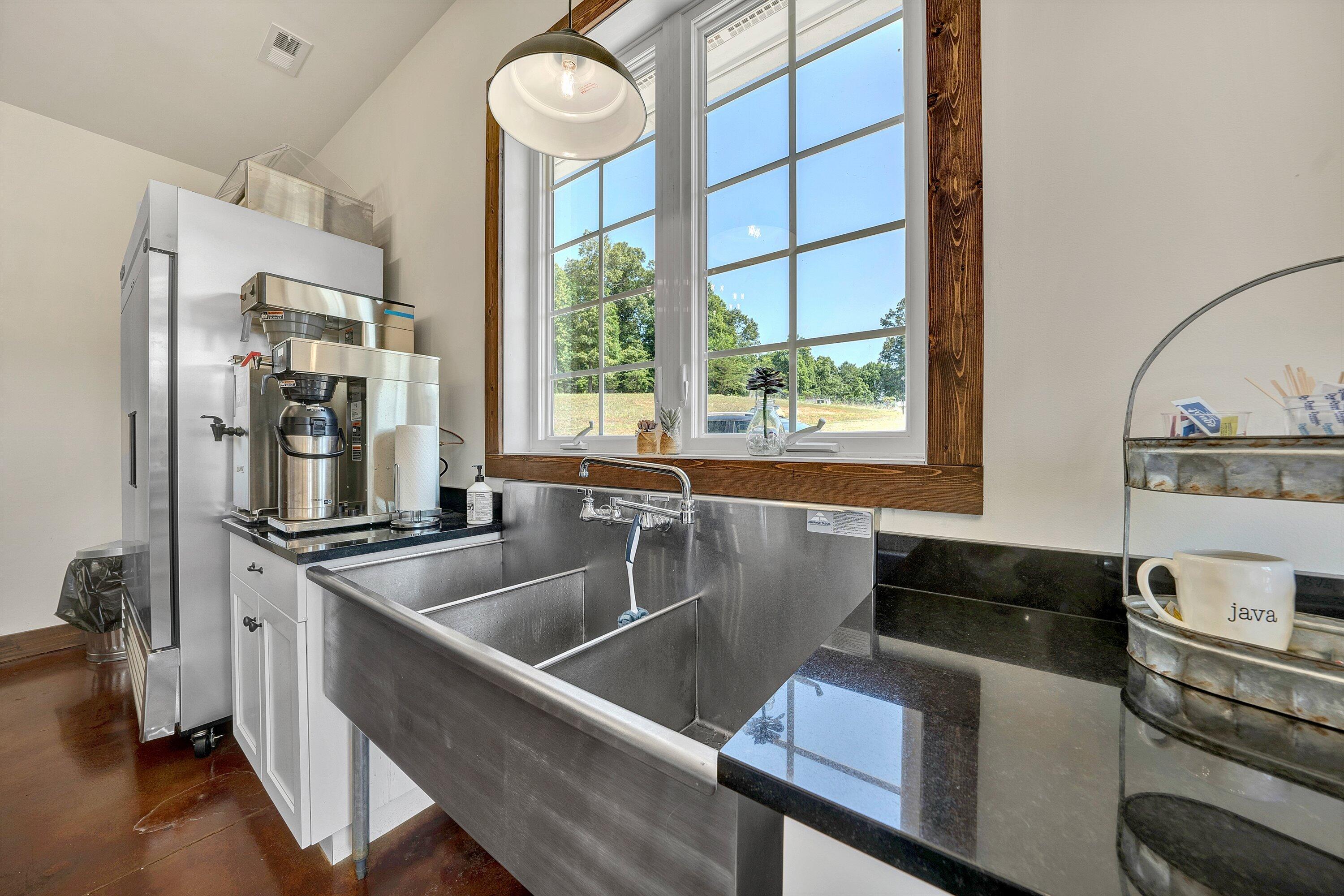 9945 Brooks Mill Road Wirtz, VA 24184 - Photo 26 of 69 a kitchen with stainless steel appliances a sink and a stove