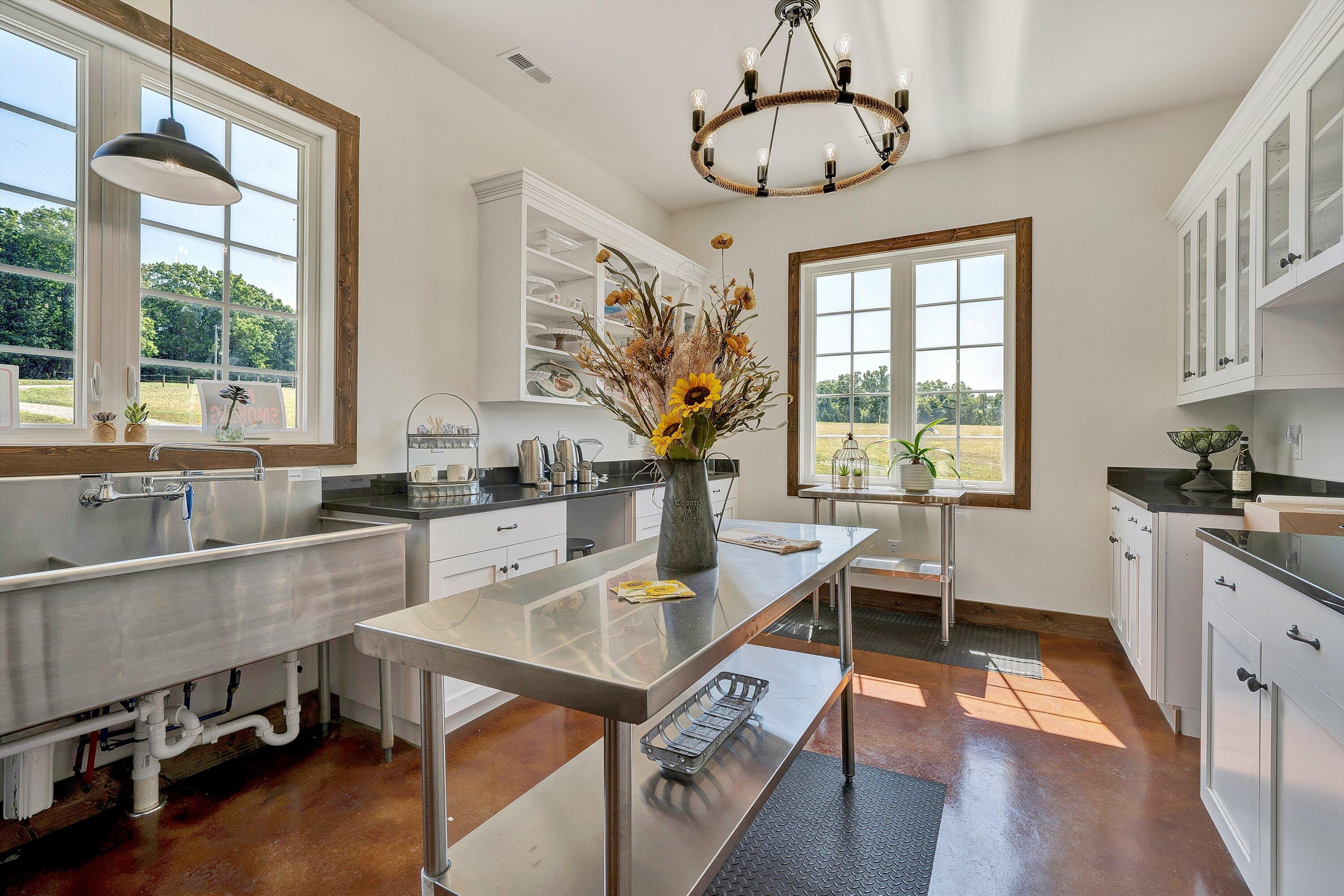 9945 Brooks Mill Road Wirtz, VA 24184 - Photo 27 of 69 a kitchen with a table chairs stove and wooden floor