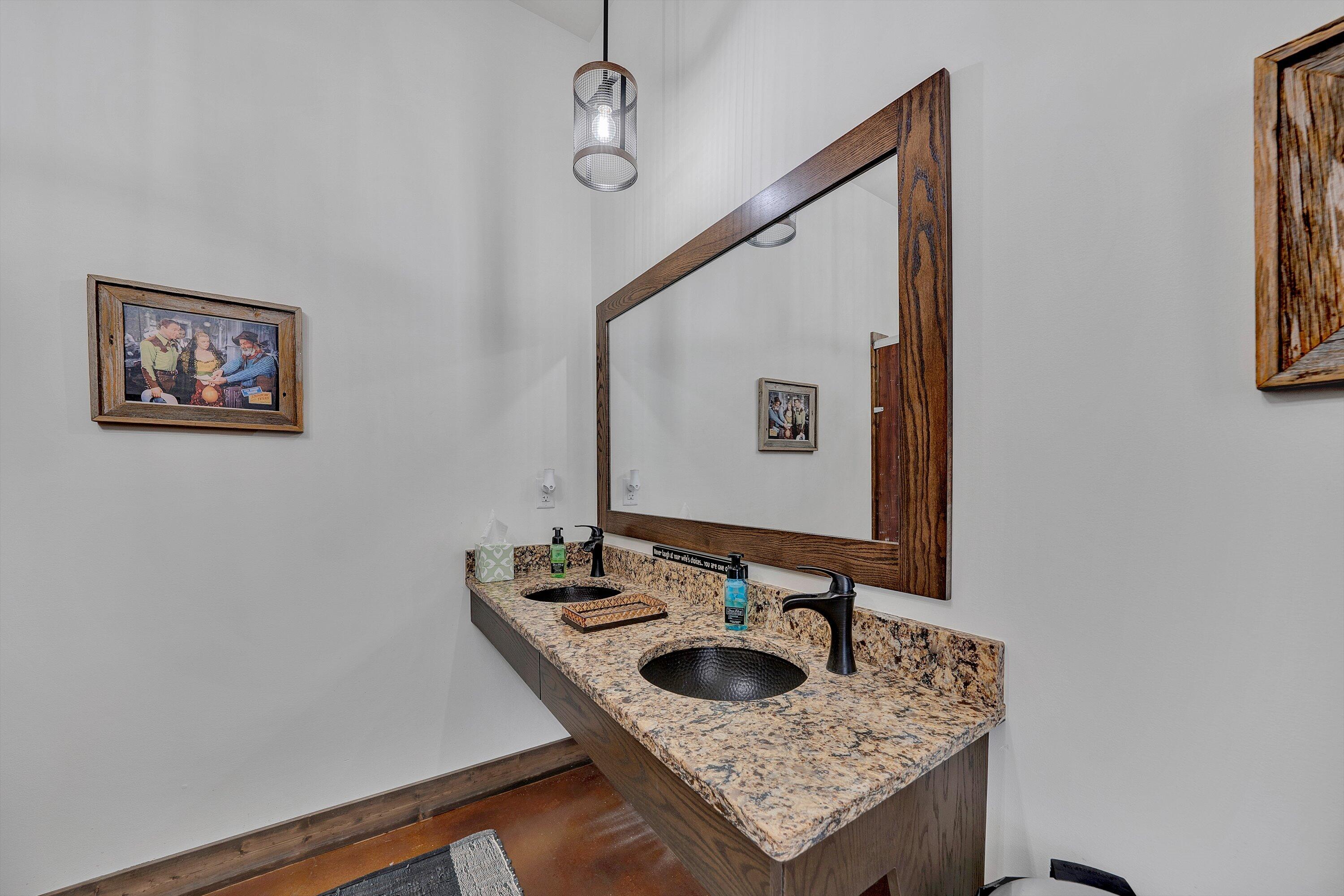 9945 Brooks Mill Road Wirtz, VA 24184 - Photo 31 of 69 a bathroom with a sink and a mirror